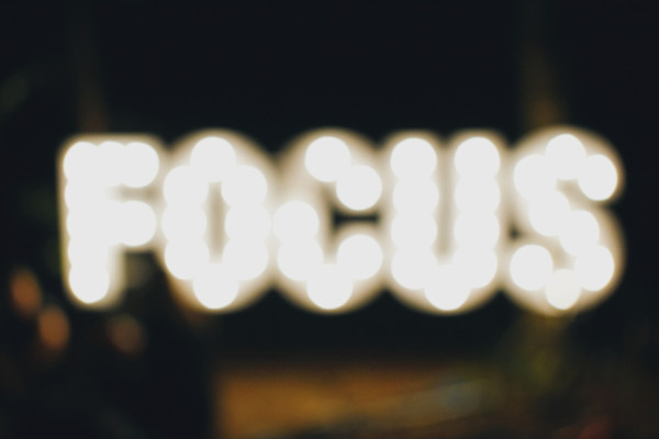 blurry picture of a sign that says "focus"