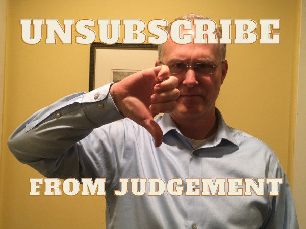 Picture of John Poelstra giving thumbs down on judgement