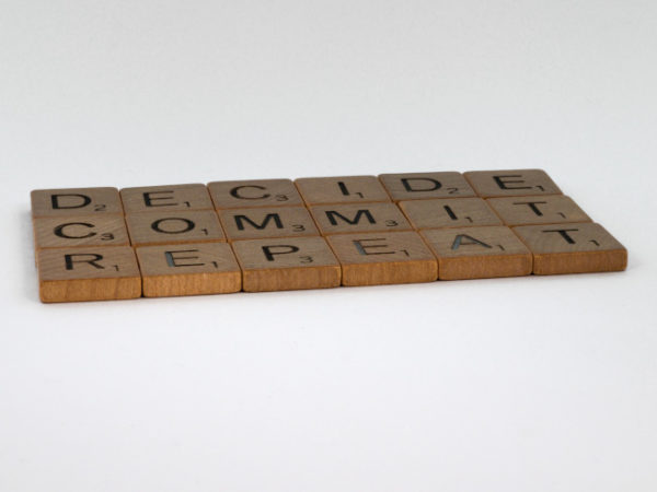 Scrabble pieces spelling commit