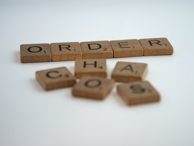 Scrabble pieces saying order chaos picture